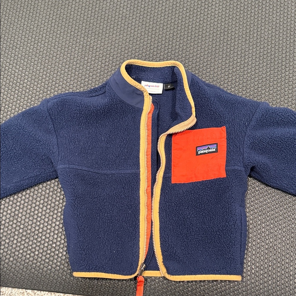 Patagonia Blue Fleece with Red and Yellow Details